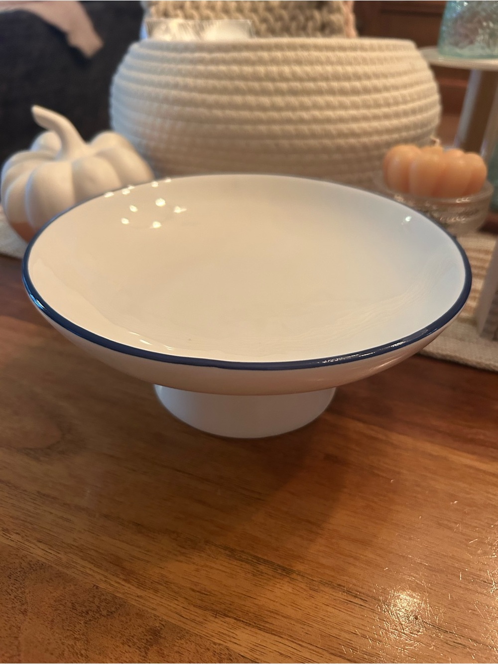 White Ceramic Pedestal Bowl with Blue Rim 8 inches wide
